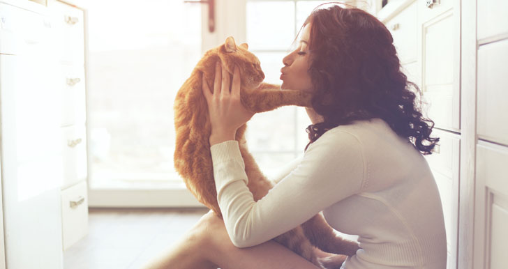 Girl Playing With Cat