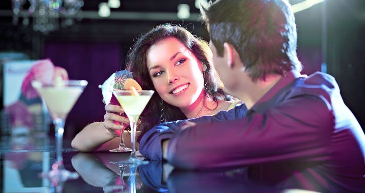 Couple flirting at the bar