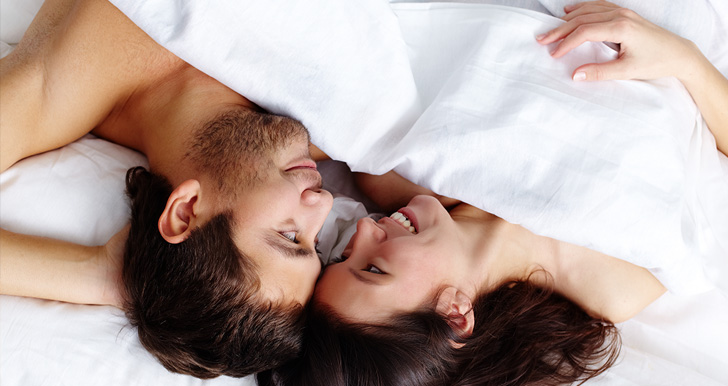 Playful couple in bed