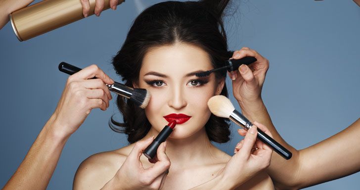 Woman getting makeup done